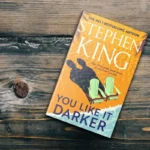 Stephen King You Like It Darker book cover photographed on wooden surface