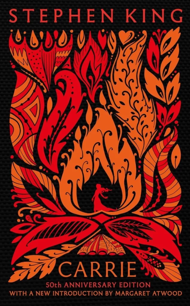 Carrie 50th Anniversary Edition by Stephen King book cover with red and orange illustrated flames on black background